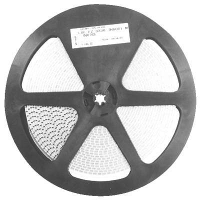 Eine Rolle mit elektronischen Bauteilen, wahrscheinlich Widerstände oder Kondensatoren, die in Reihen um die Spule organisiert sind und für die automatisierte Montage verwendet werden.