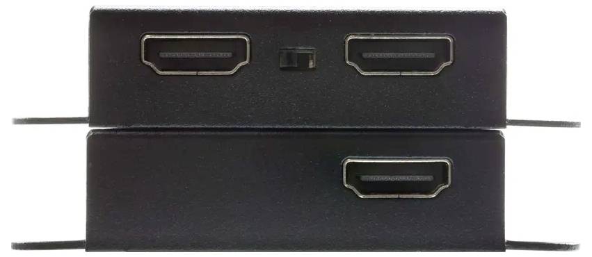 Zwei übereinander gestapelte schwarze rechteckige Anschlüsse mit mittig positionierten Steckeröffnungen und einem kleinen Schalter zwischen den oberen Anschlüssen.