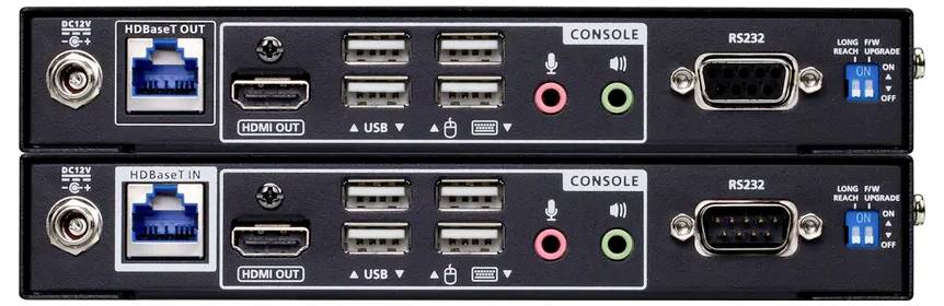 Zwei übereinander gestapelte elektronische Geräte mit Anschlüssen für Netzwerk (HDBaseT), HDMI, USB, Audio (rosa/rot, grün) und RS232-Verbindungen.