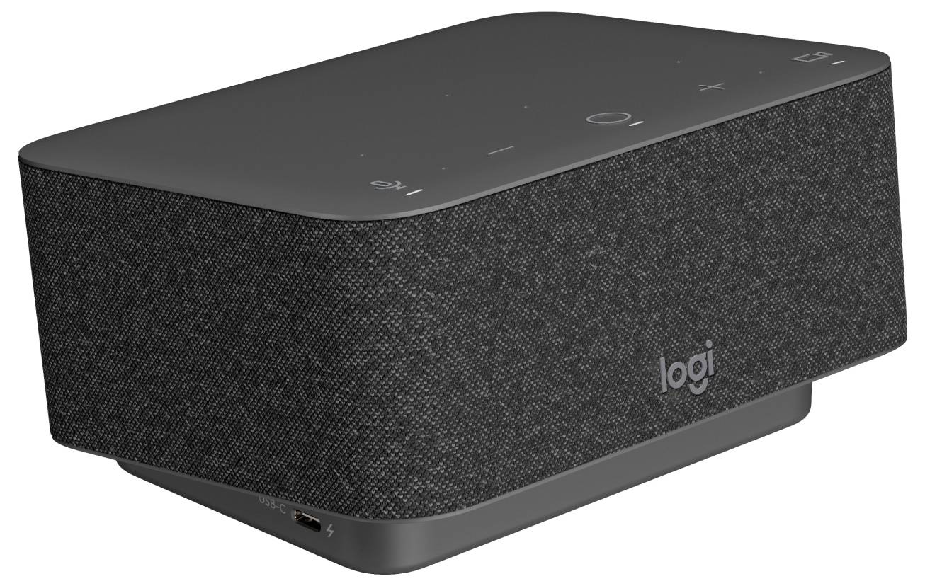 Ein schwarzer Logitech-Lautsprecher mit Stoffbezug und Touchbedienfeldern auf der Oberseite, auf denen Lautstärkesteuerung und Einstellungssymbole zu sehen sind, steht auf einer Oberfläche.