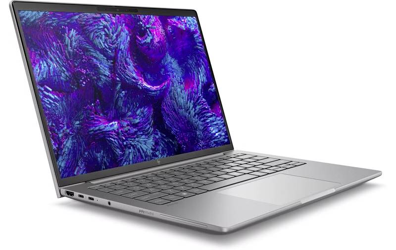 Ein silberner Laptop mit einem lebhaften abstrakten Muster in Lila und Blau auf dem Bildschirm. Der Laptop ist geöffnet und zeigt eine vollständige Tastatur.