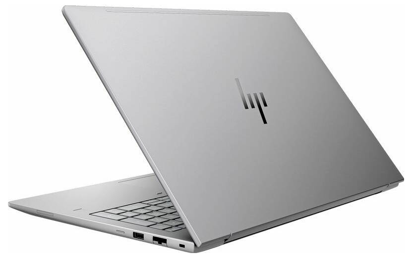 Ein schlanker, silberner Laptop, halb geöffnet, zeigt die Tastatur und Anschlüsse. Das Gerät präsentiert ein minimalistisches und modernes Design.