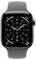 Eine Smartwatch mit einem analogen Zifferblatt, das zwei Zeitzonen, Datums-Anzeigen und Aktivitätsringe zeigt, ausgestattet mit einem grauen Armband.