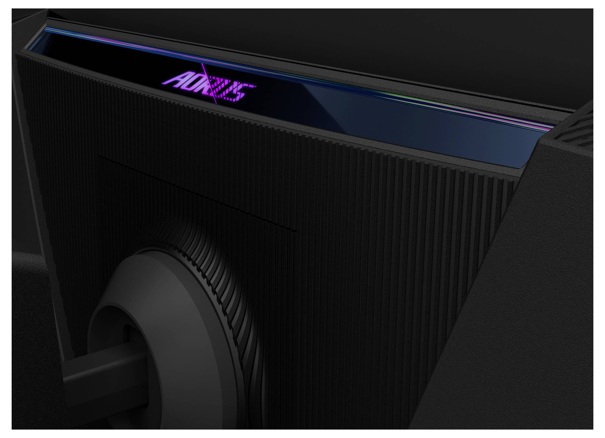 Das Bild zeigt die Rückansicht eines schwarzen Monitors, auf dessen oberer Kante das beleuchtete Logo 'AORUS' zu sehen ist, was auf einen Fokus auf Gaming hindeutet.