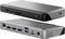 Eine Docking-Station mit Doppelansicht, die verschiedene Anschlüsse wie HDMI, USB-C, USB-A, SD-Kartenslot, Ethernet und Kopfhörerbuchse zeigt.