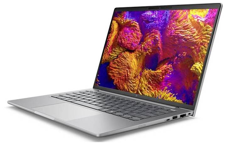 Silberner Laptop mit offenem Bildschirm, der ein buntes, abstraktes Muster zeigt. Sichtbar sind Tastatur und Anschlüsse an der Seite.