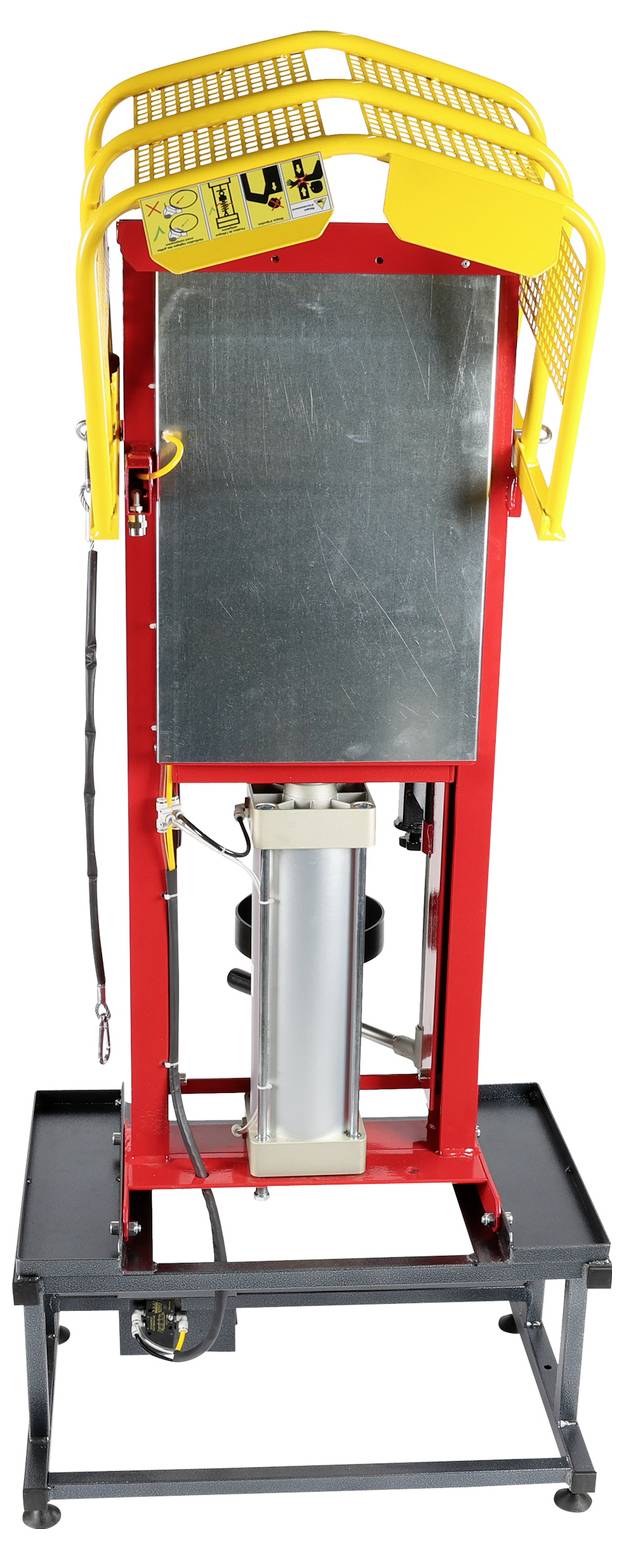 Eine rote und gelbe industrielle hydraulische Pressmaschine steht auf einer schwarzen Metallbasis und verfügt über Schutzkäfige und elektrische Komponenten.