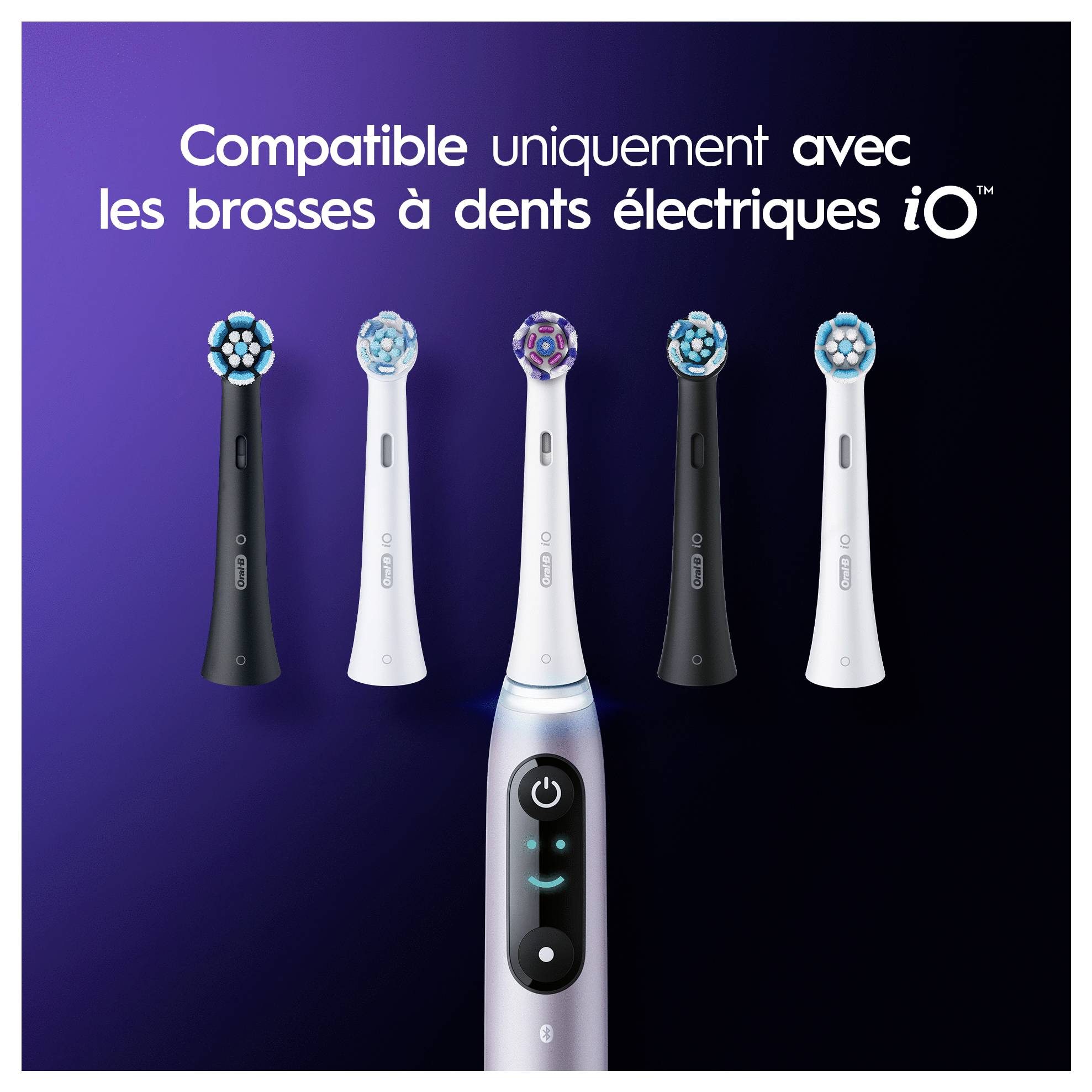 Das Bild zeigt fünf iO Elektrozahnbürstenköpfe in verschiedenen Farben über einem französischen Text, der besagt, dass sie nur mit iO Elektrozahnbürsten kompatibel sind.