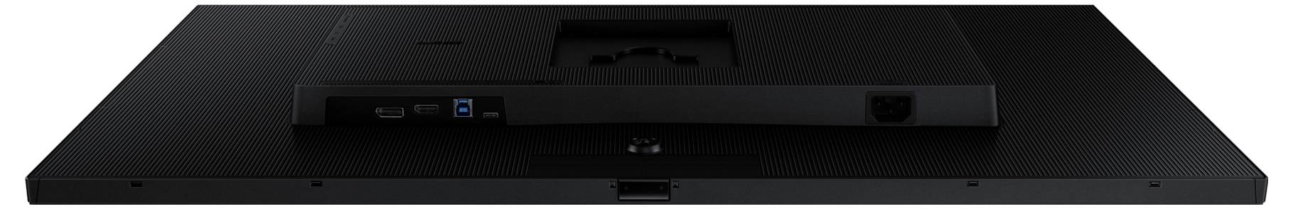 Das Bild zeigt die Rückseite eines flachen, schwarzen elektronischen Geräts mit sichtbaren Anschlüssen, einschließlich USB- und Stromverbindungen.