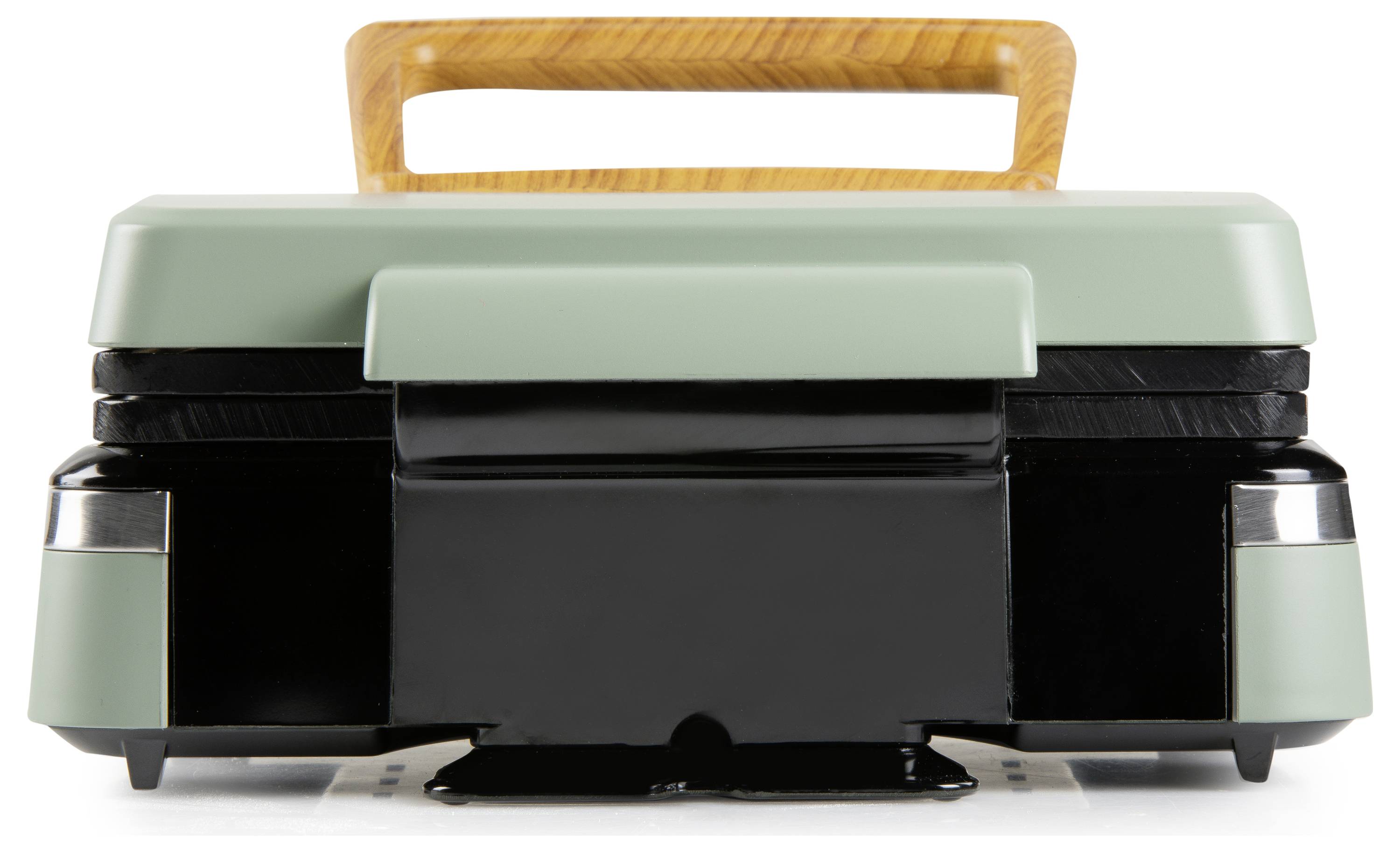 Eine grüne und schwarze Sandwichpresse mit einem Holzgriff steht auf einer weißen Oberfläche, von vorne betrachtet.