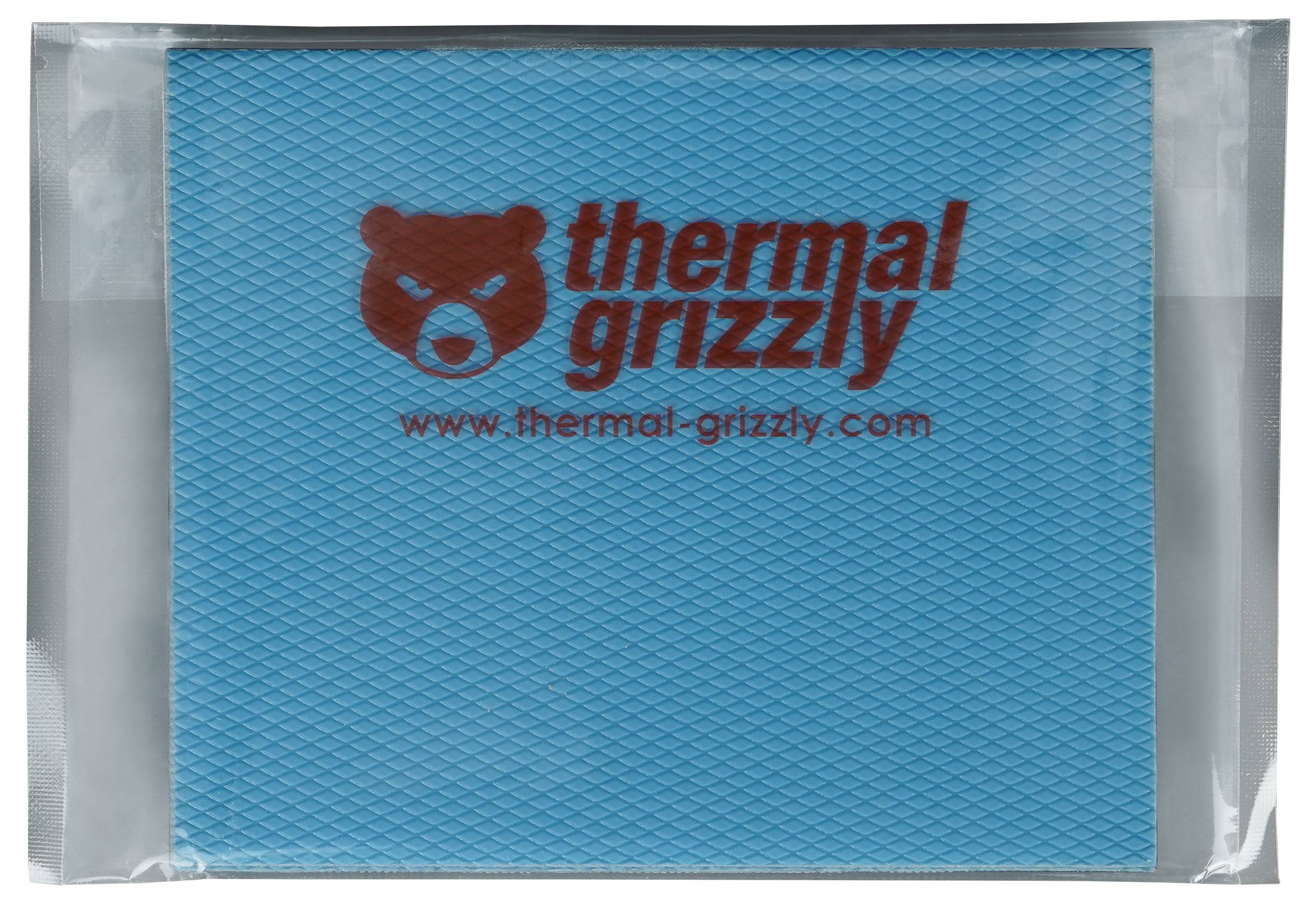 Logo von 'Thermal Grizzly' auf blauer strukturierter Oberfläche mit Bären-Grafik, www.thermal-grizzly.com-Text darunter; Verpackungskanten sichtbar.