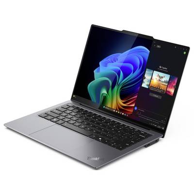 Ein silberner Laptop mit einem farbenfrohen Bildschirmanzeige, der eine Windows-Benutzeroberfläche zeigt und eine geöffnete 'Spotify'-App auf der rechten Seite.