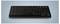 Eine kompakte schwarze Tastatur mit QWERTZ-Layout auf einem hellblauen Hintergrund, entwickelt für effizientes Tippen auf begrenztem Raum.