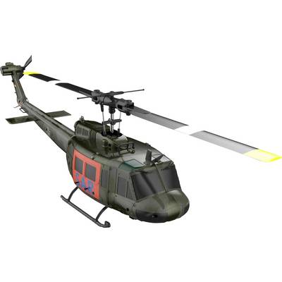 Ein grüner militärischer Hubschrauber mit 'SAR' in Rot und Blau an der Seite, ausgestattet mit einem markanten Hauptrotor und Heckrotor.