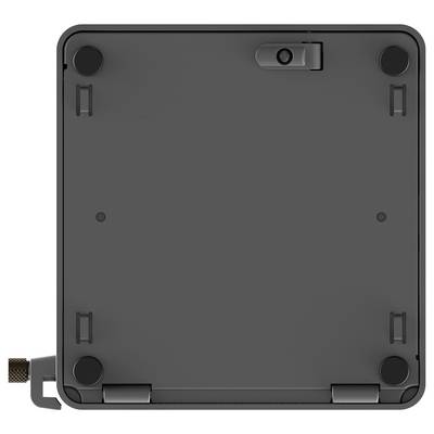 Ein quadratisches, dunkelgefärbtes elektronisches Gerät von unten betrachtet, mit vier kreisförmigen Pads an den Ecken und einem kleinen Scharnier auf einer Seite.