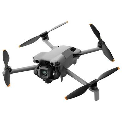 Ein grauer Quadcopter-Drohne mit angebrachter Kamera, ausgestattet mit vier Propellern und orangefarbenen Spitzen, wird aus einem Seitenwinkel in Flugposition gezeigt.