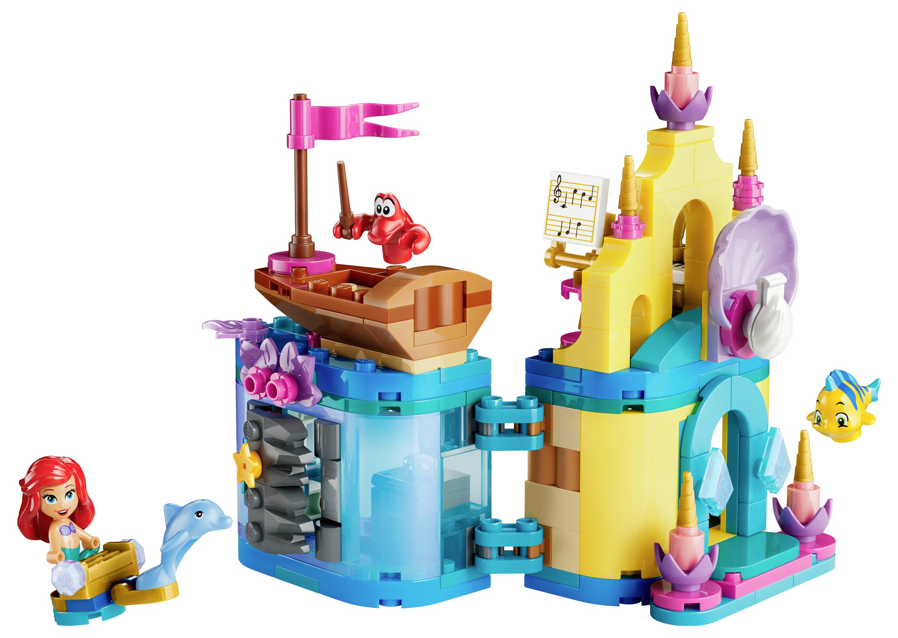 Spielset, das eine Unterwasserszenerie mit einer Meerjungfrau, einem Delfin, einem gelben Fisch und einer roten Krabbe auf einem Boot darstellt, mit bunten aquatischen Strukturen.