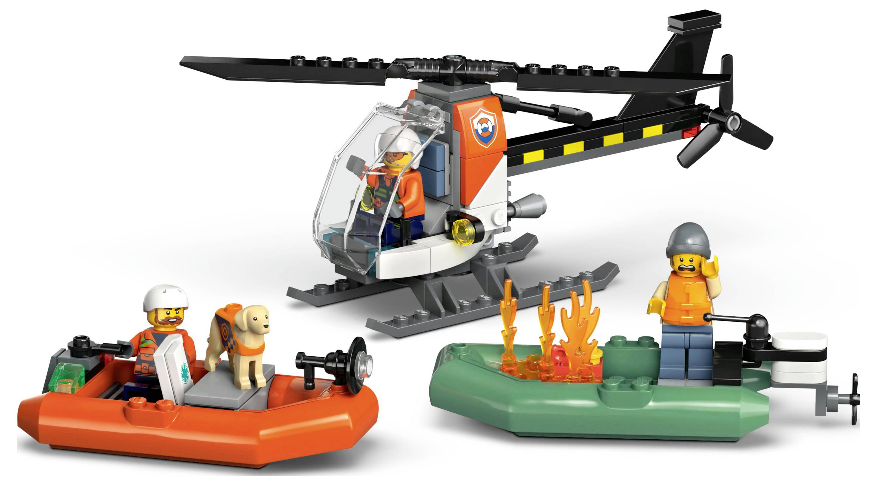 Ein Spielzeughubschrauber und zwei Boote mit Figuren, einschließlich eines Retters, eines Hundes und Flammen in einer spielerischen Rettungsszene.
