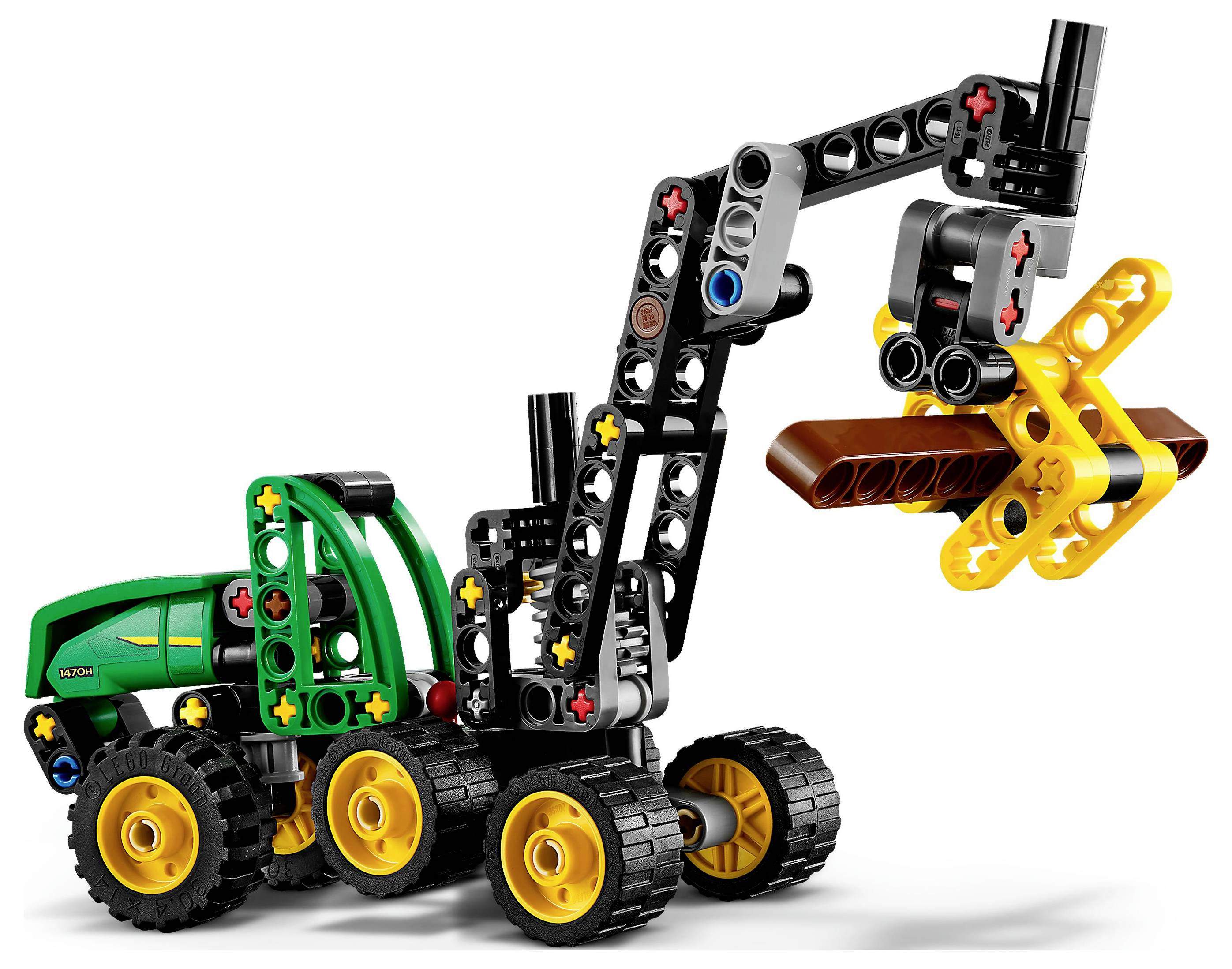 Ein Spielzeug-Baufahrzeug, das aus bunten ineinandergreifenden Plastikteilen gebaut wurde, mit einem ausfahrbaren Arm, der einen braunen Balken hält.