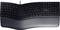 Ergonomische Tastatur mit geteiltem Design, dunklem Gehäuse und integrierter Handballenauflage für komfortables Tippen.