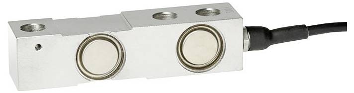 Ein Metallwägezellen-Sensor mit kreisförmigen Elementen und einem angeschlossenen schwarzen Kabel, verwendet zur Messung von Gewicht oder Kraft.