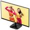 Ein Computermonitor zeigt ein Bild von zwei lächelnden Frauen in leuchtend bunten Outfits, die vor einem gelben Hintergrund tanzen.