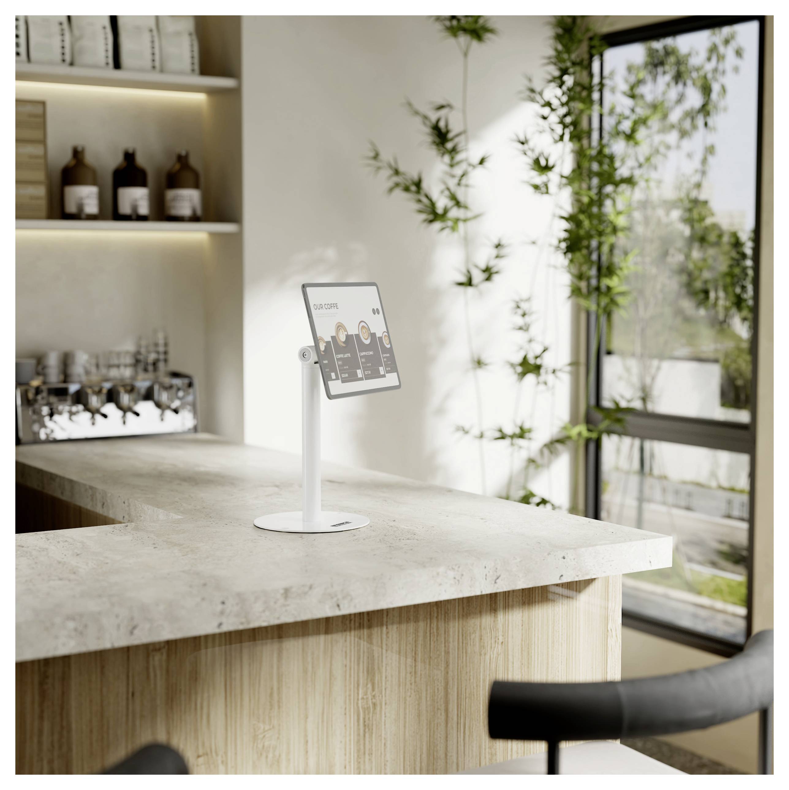 Eine elegante, moderne Küche mit einer L-förmigen Arbeitsplatte, Pflanzen am Fenster und einem digitalen Tablet auf der Arbeitsplatte, auf dem „Square" angezeigt wird.