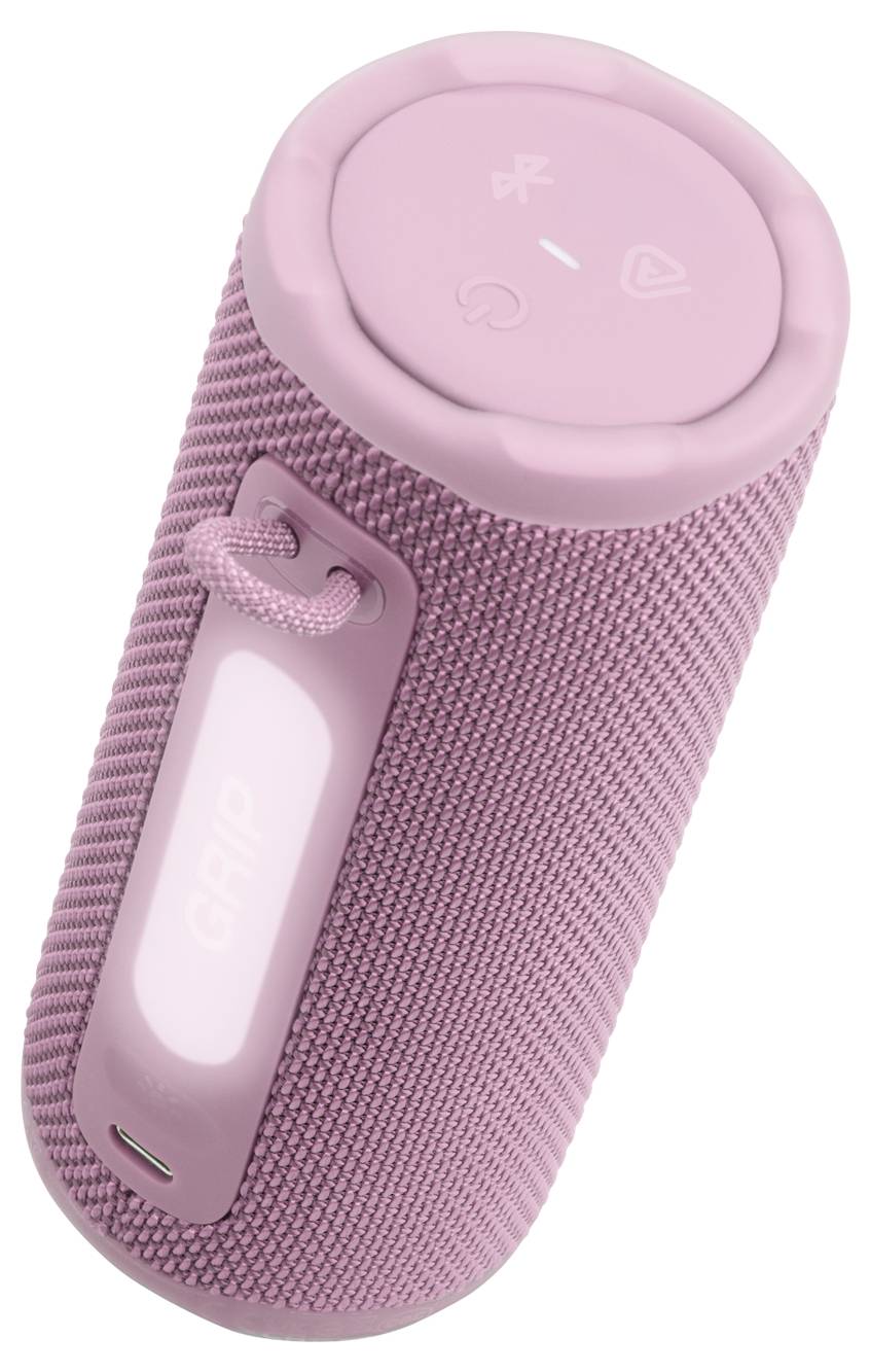Rosa tragbarer Bluetooth-Lautsprecher mit strukturierter Oberfläche und Bedienungstasten oben. Der Lautsprecher verfügt über einen Trageriemen für einfachen Transport.