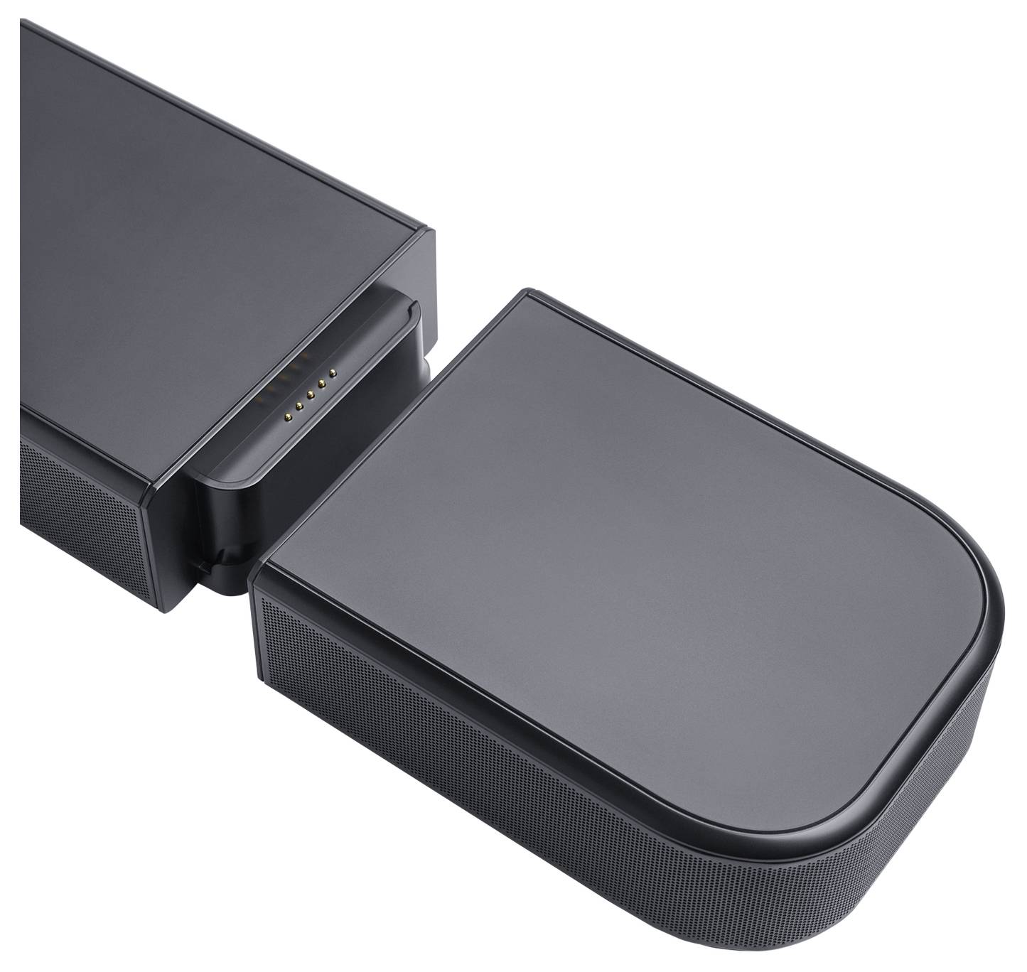 Ein rechteckiger schwarzer Lautsprecher mit einem abnehmbaren Ende, an dem Anschluss-Pins zu sehen sind.