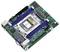 Eine kleine Mainboard mit einem CPU-Sockel in der Mitte, umgeben von vier RAM-Steckplätzen und verschiedenen Anschlüssen an den Kanten.