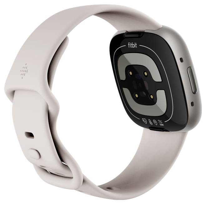 Eine Smartwatch mit einem beigen Armband, die ihre Sensorseite zeigt und ein 'Fitbit' Markenlogo trägt. Entwickelt zur Verfolgung von Fitness- und Gesundheitsmetriken.