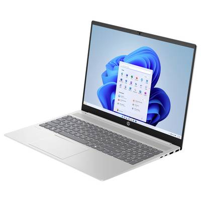 Ein silberner Laptop mit einem Windows-Betriebssystem auf dem Bildschirm, auf dem App-Symbole und ein blauer Wirbel-Hintergrund zu sehen sind.