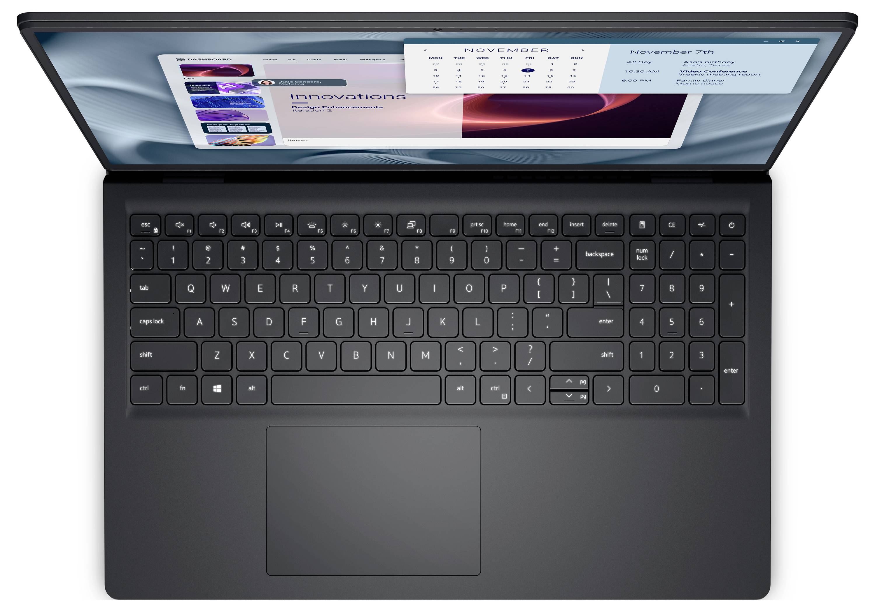 Ein Laptop aus Draufsicht, der einen Kalender und App-Kacheln auf dem Bildschirm zeigt. Der Laptop verfügt über eine schwarze Tastatur mit einem großen Touchpad.