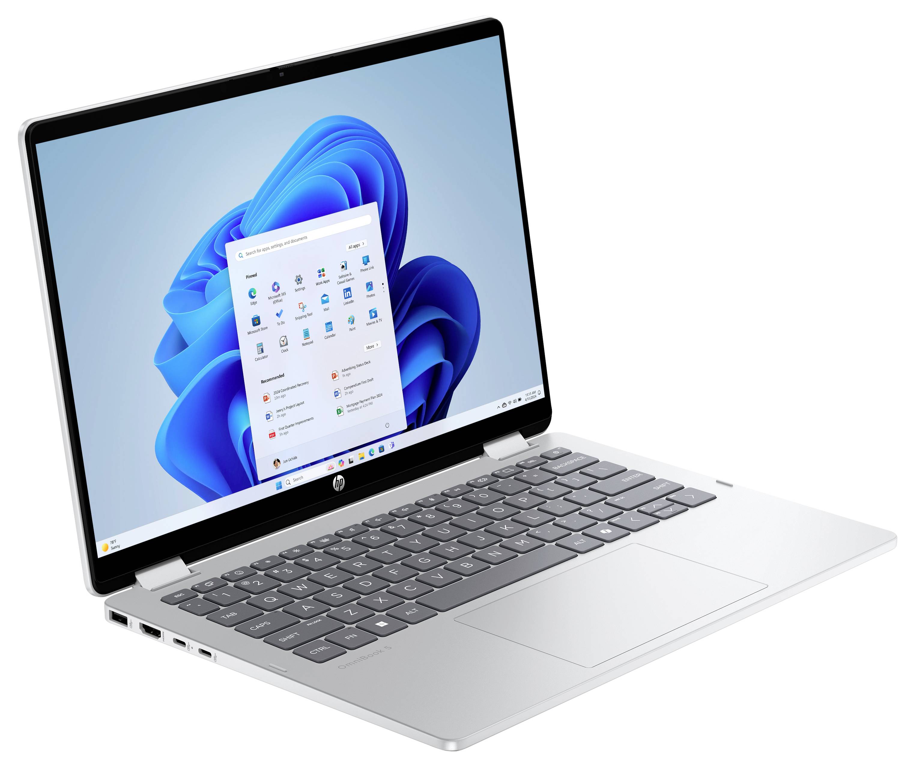 Ein silberner Laptop, der ein Windows-Betriebssystem auf seinem Bildschirm anzeigt.