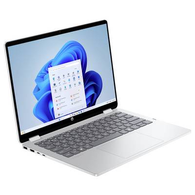 Ein silberner Laptop, der ein Windows-Betriebssystem auf seinem Bildschirm anzeigt.