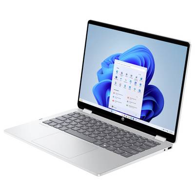 Ein moderner silberner Laptop, der ein Windows-Betriebssystem auf dem Bildschirm anzeigt, mit verschiedenen Anwendungssymbolen und einer Taskleiste.