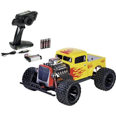 RC Monster Truck Spielzeug mit Flammen-Dekals, schwarzer Fernbedienung, aufladbarem Akkupack, Ladekabel und mitgelieferten AA-Batterien.