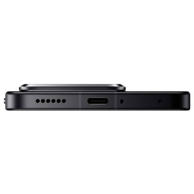 Nahaufnahme einer Smartphone-Seitenansicht mit Lautsprecher, USB-C-Anschluss und Mikrofonlöchern in elegantem Schwarz.