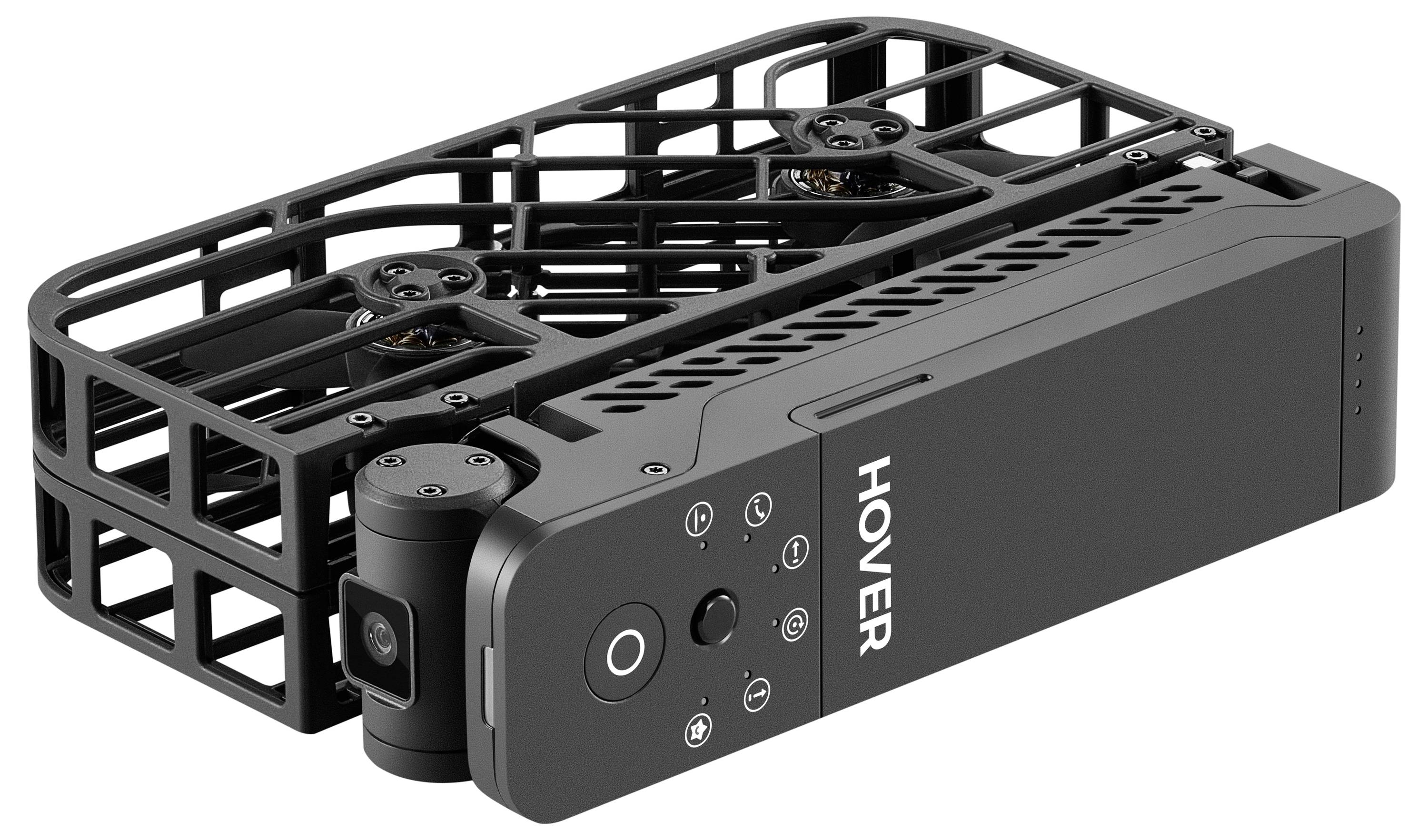 Tragbarer schwarzer Drohne mit geschlossenen Rotorblättern, mit dem Schriftzug "HOVER" versehen, ausgestattet mit einer nach vorne gerichteten Kamera und Steuerungstasten oben auf dem Gerät.