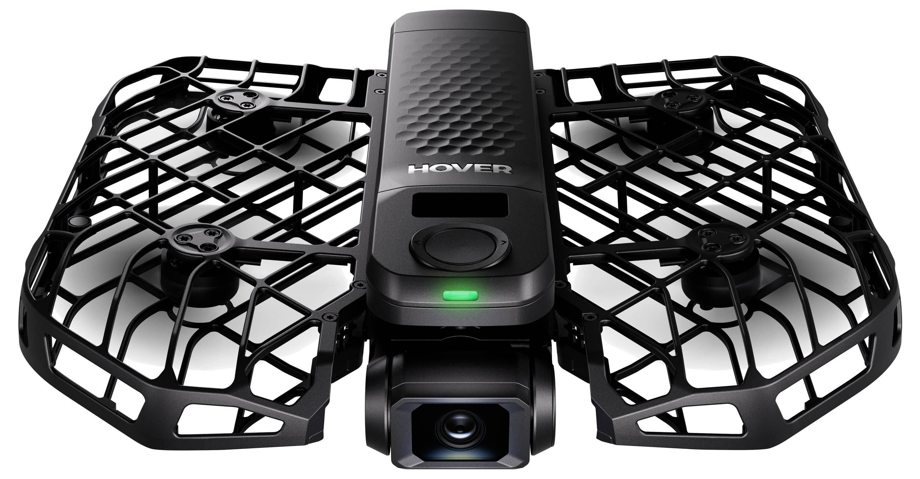 Ein schwarzer Quadcopter-Drohne mit einem Schutzgehäuse um seine Propeller, oben mit 'Hover' beschriftet. Er verfügt über eine Kamera an der Vorderseite.