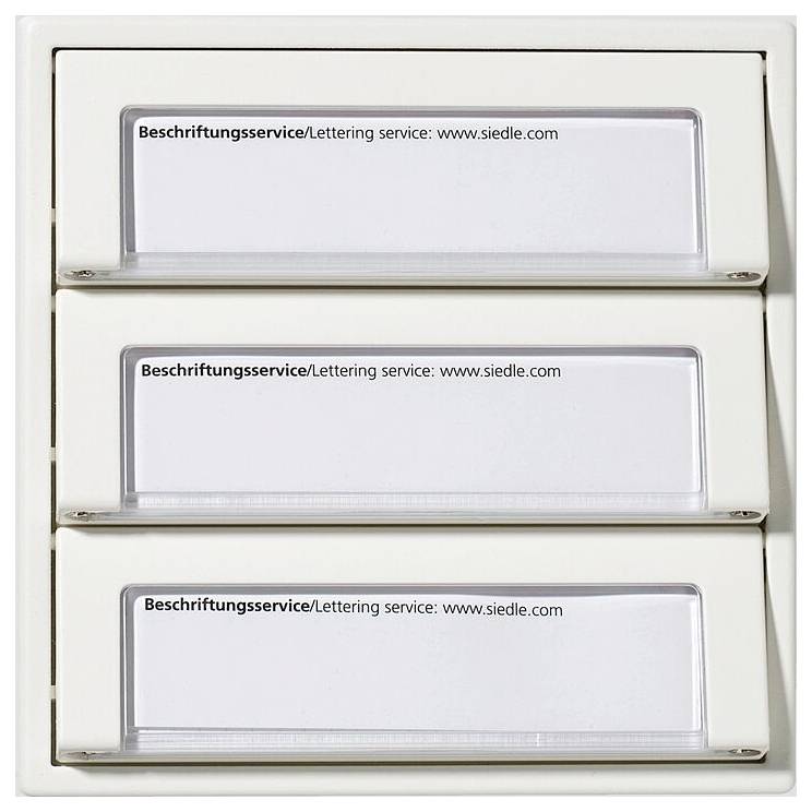 Drei beschriftete Slots mit „Beschriftungsservice/Lettering service: www.siedle.com" für anpassbare Einsätze in einem weißen Halter.