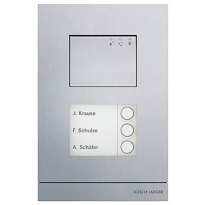 Ein Sprechanlage-Panel mit drei Tasten mit den Beschriftungen „J. Krause", „F. Schulze" und „A. Schäfer", eingelassen in einem gebürsteten Metallrahmen.