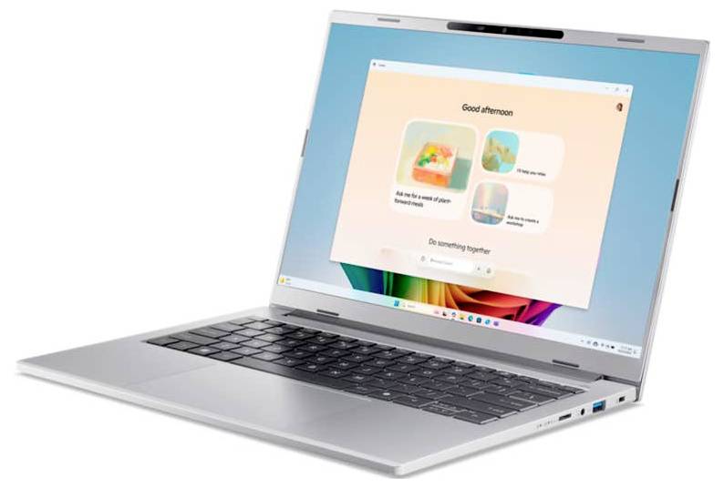 Schlankes silbernes Laptop mit einer dunklen Tastatur, das einen bunten Bildschirm mit einer Willkommensnachricht und mehreren quadratischen Symbolen zeigt.
