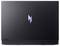Geschlossener Laptop mit beleuchtetem Logo auf dem Deckel vor einem einfarbigen Hintergrund.