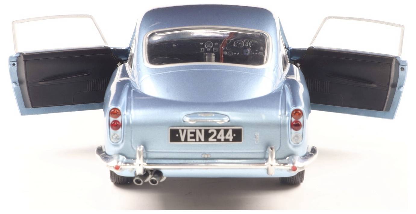 Ein blaues Vintage-Automodell mit offenen Türen, von hinten betrachtet, mit dem Nummernschild 'VEN 244' und detailliertem Armaturenbrett im Innenraum.