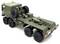Ein grüner militärischer Spielzeug-Lastwagen mit sechs Rädern, Ladefläche und Reservereifen auf der Rückseite, aus einem seitlichen Heckwinkel aufgenommen.