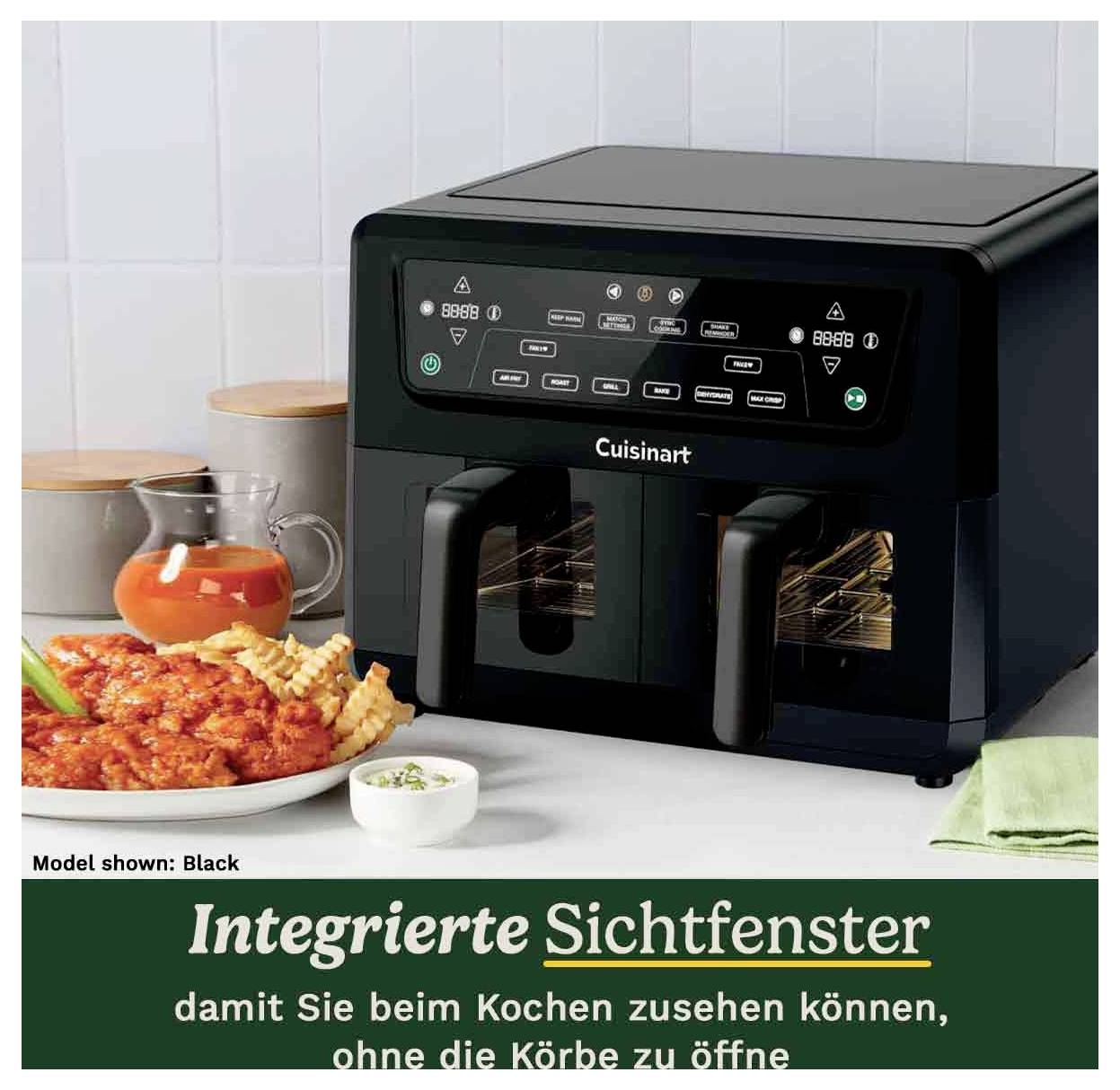 Schwarzer Cuisinart-Fritteuse mit zwei Sichtfenstern, um den Kochvorgang zu beobachten. Gerichte daneben symbolisieren Vielfalt der Zubereitung.