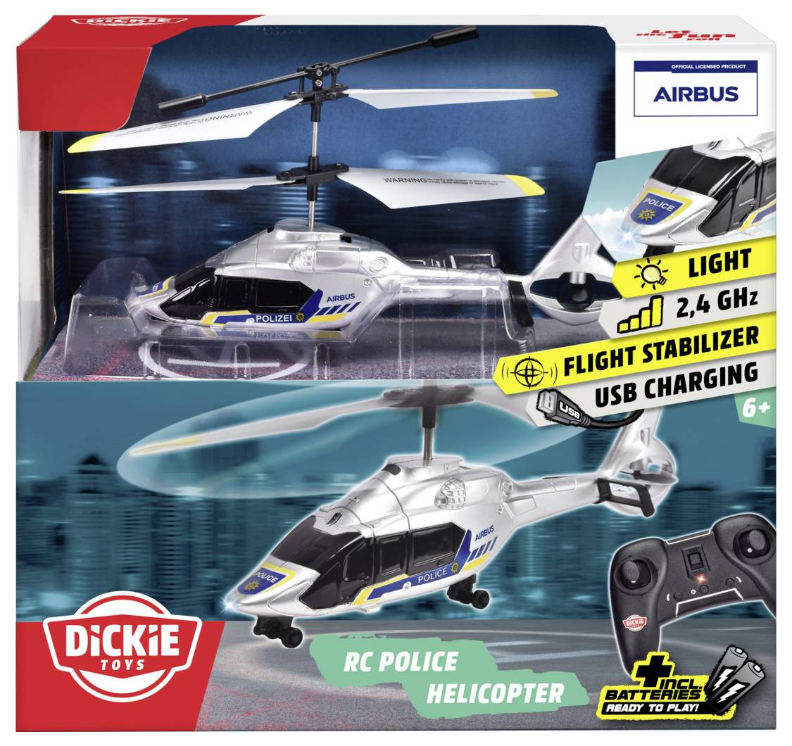 RC Polizeihubschrauber im Karton mit Fernbedienung. Funktionen umfassen Licht, 2,4 GHz, Flugstabilisator, USB-Ladung. Geeignet für Kinder ab 6 Jahren.