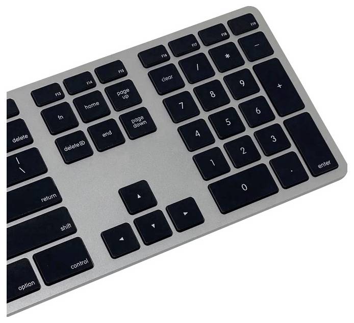 Silberne und schwarze Computertastatur mit numerischem Tastenfeld auf der rechten Seite, mit Tasten für Funktionen wie Löschen, Eingabetaste und Umschalt.