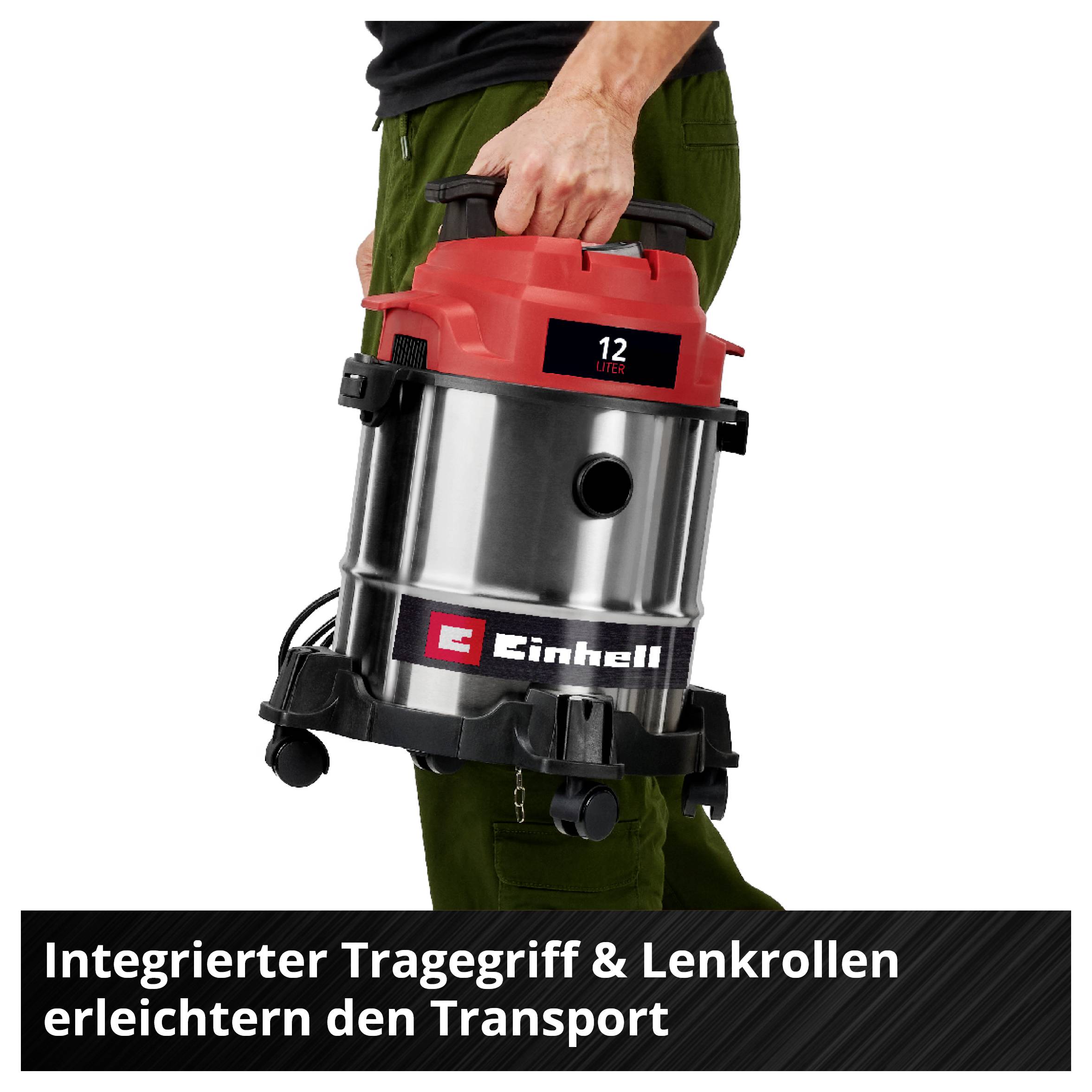 'Mann trägt Industriesauger mit rotem Deckel und Handgriff. Text im Bild: Integrierter Tragegriff & Lenkrollen erleichtern den Transport.'